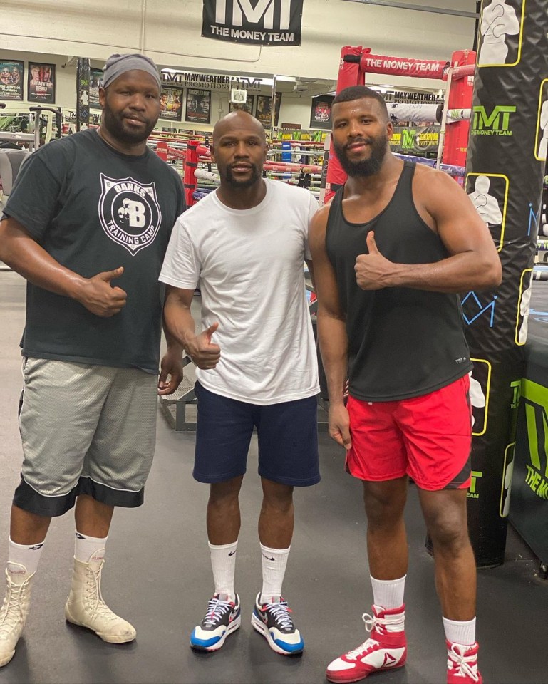 Floyd Mayweather next to Badou Jack, right