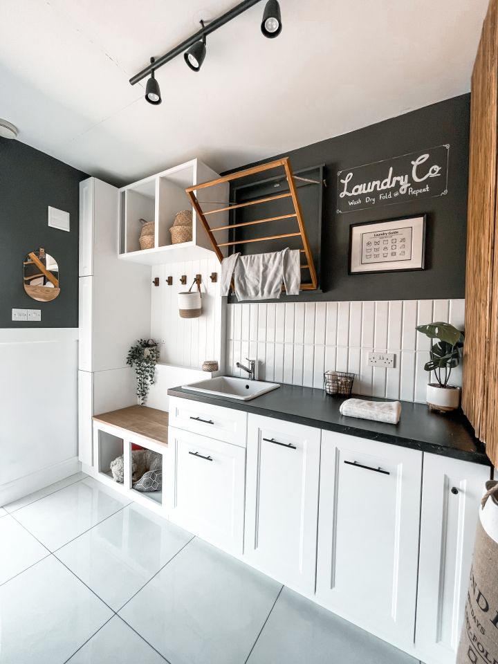 In the laundry room, Shauna made a cost-free wall-mounted drying rack using parts of an old wooden baby gate