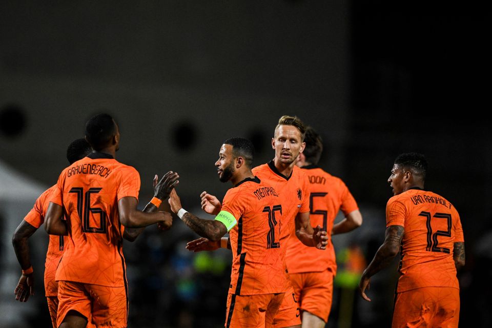 The Lyon winger celebrates with his team-mates after sparring their blushes