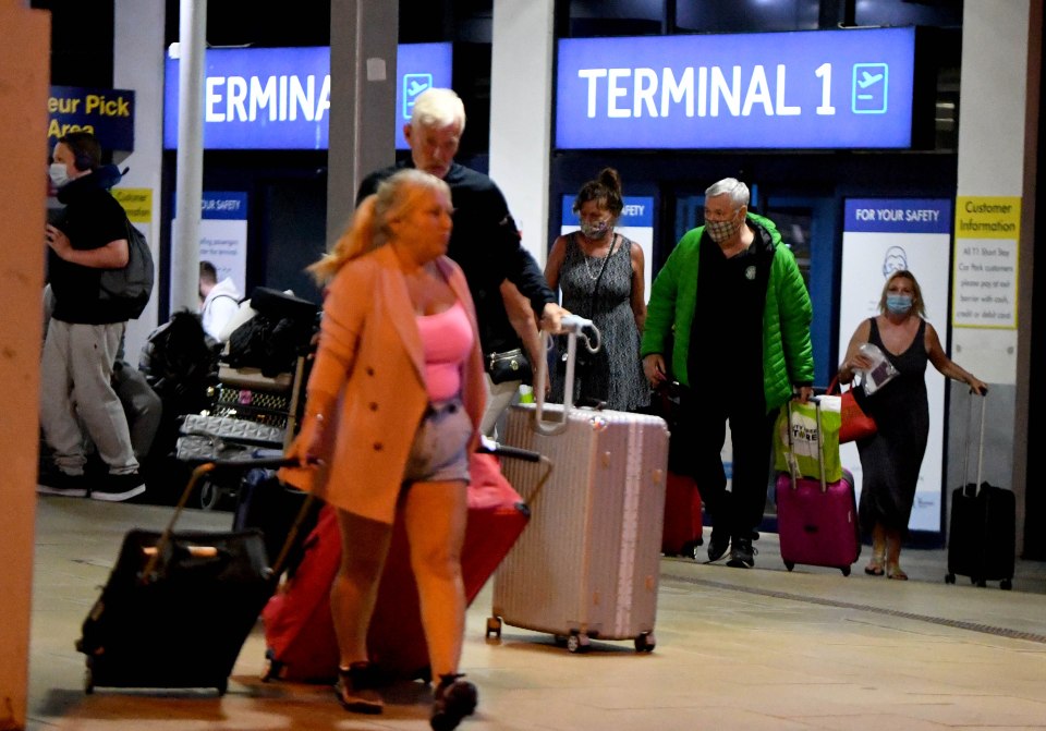 Most passengers wore masks as they left the terminal