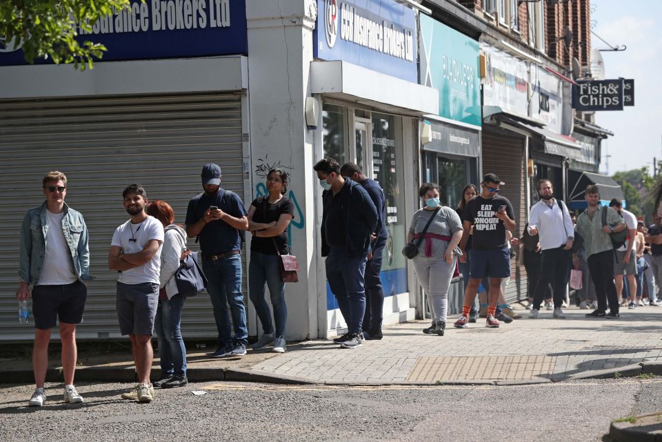 People queue for a vaccine in Harrow