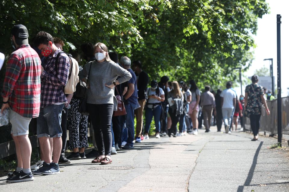 People queuing at Belmont Health Centre in Harrow which is offering a first jab to anyone over 18