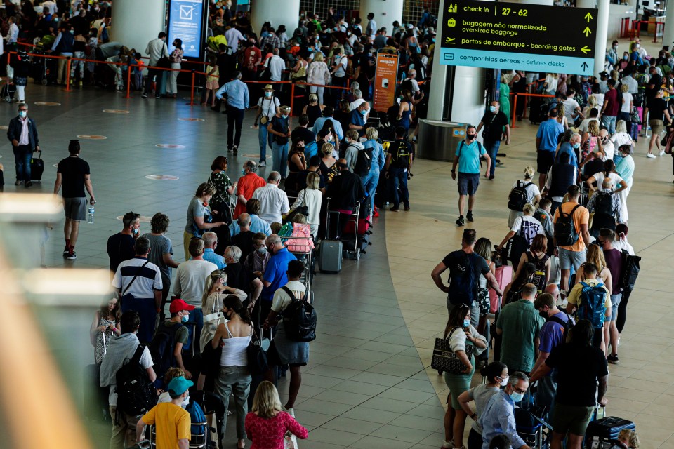 Long queues of holidaymakers have been snapped inside the airport