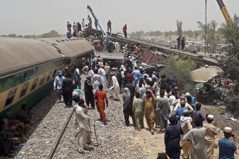 Mangled carriages lie on their sides after the horror head-on crash