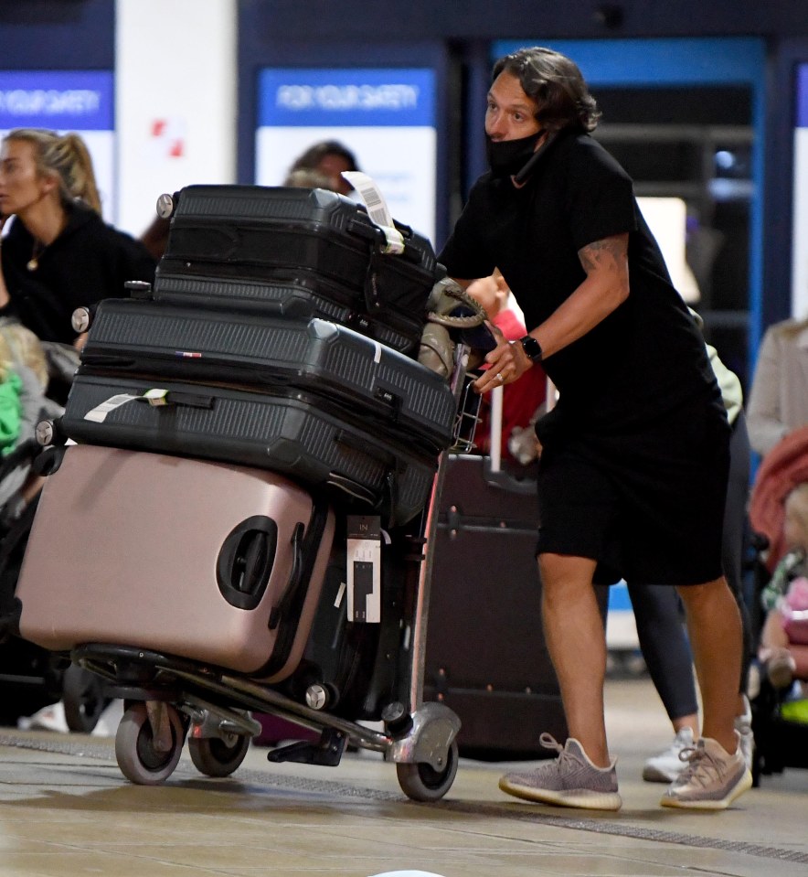 Passengers arriving in Manchester after catching the last flights back to the UK before Portugal joins the amber list