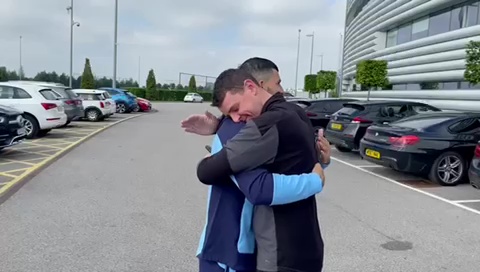 The two share a hug before the player leaves Man City