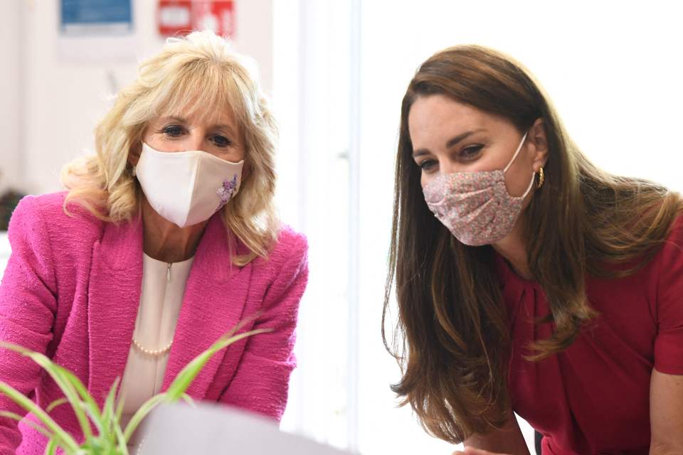 Kate wore a £1,125 fuchsia dress by Alexander McQueen while Dr Jill was chic in a hot pink blazer by L'Agence