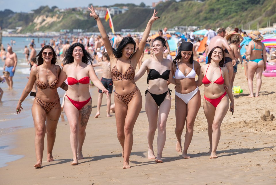 A group of friends enjoy a day trip to Bournemouth beach