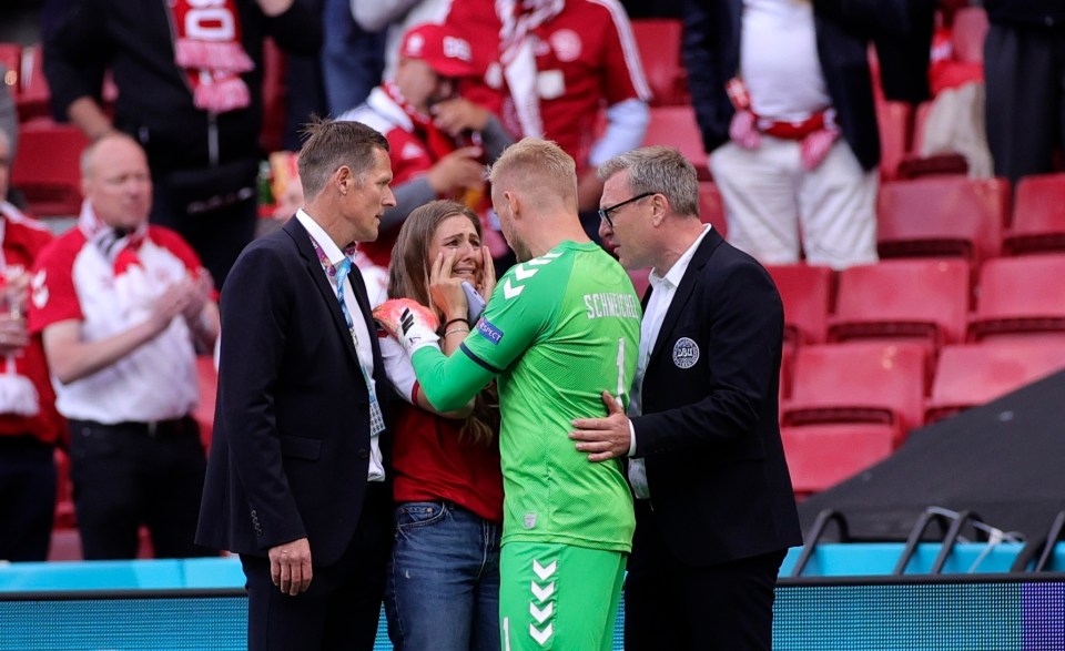 Sabrina is comforted by Kasper Schmeichel after Eriksen's collapse