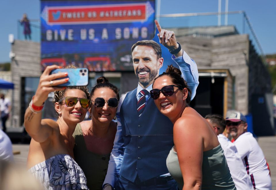 Girls pose with a Gareth Southgate cutout in Hastings