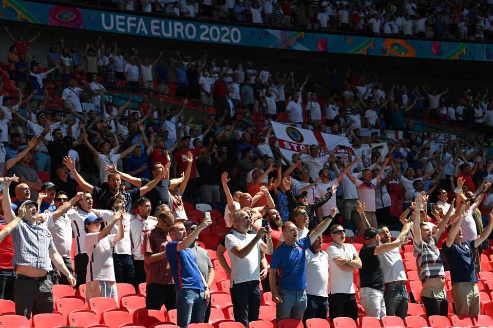 Supporters raised a drink inside Wembley as the whistle blew