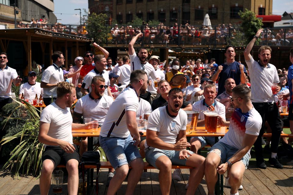 Fans in Vinegar Yard cheer as the game kicks off