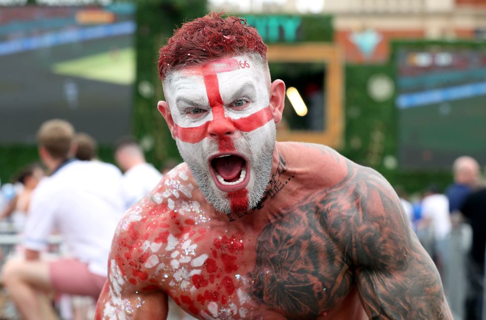 A fan in Manchester shows off his red and white war paint