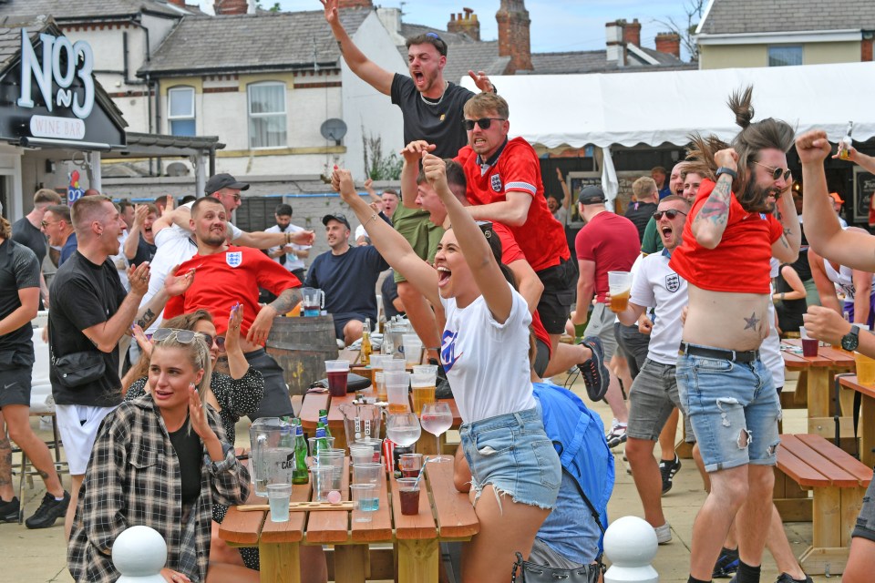 Fans leap in the air in Blackpool