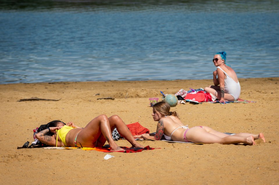 Ladies catch some rays at Ruislip Lido in north-west London