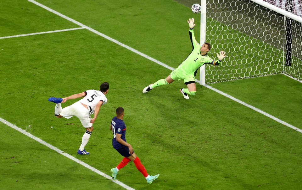 Germany veteran Mats Hummels can't adjust his feet quick enough as he puts through his own net for the France winner