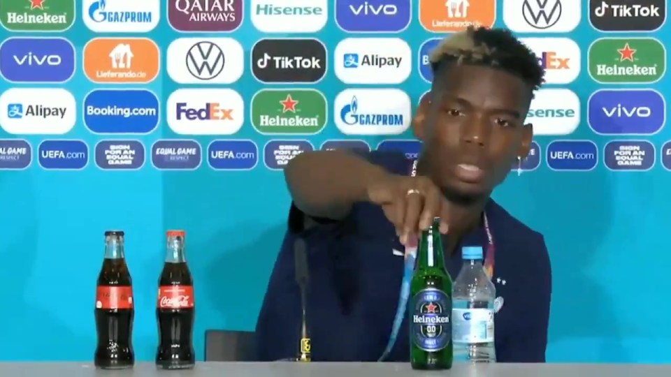 France international Paul Pogba removed a Heineken bottle during his post-match press conference