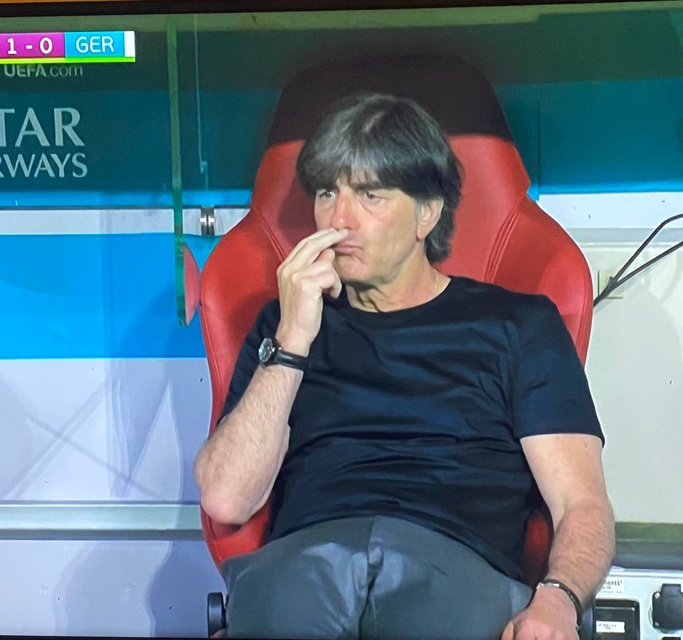 Joachim Low sniffs his fingers as his team lose to France