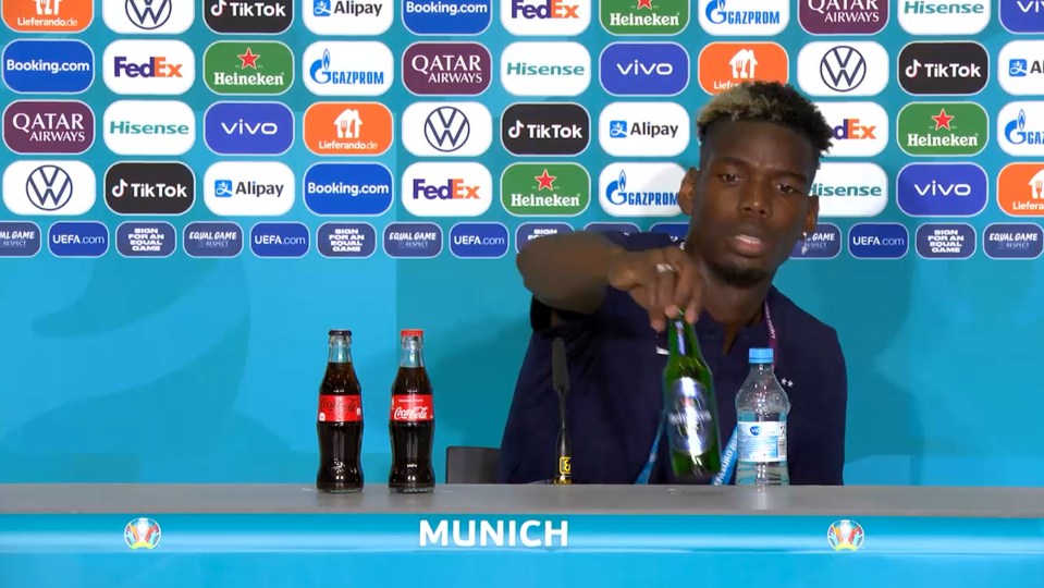 Paul Pogba moved a Heineken bottle out the way