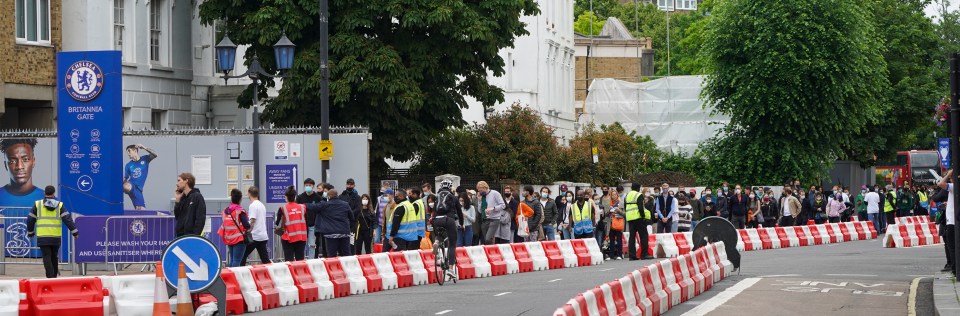 Long queues form at a Covid mass vaccination at Chelsea’s Stamford Bridge stadium