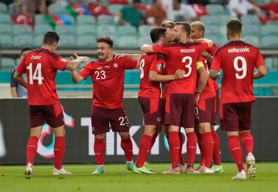 Switzerland celebrate taking the lead in their crucial group clash