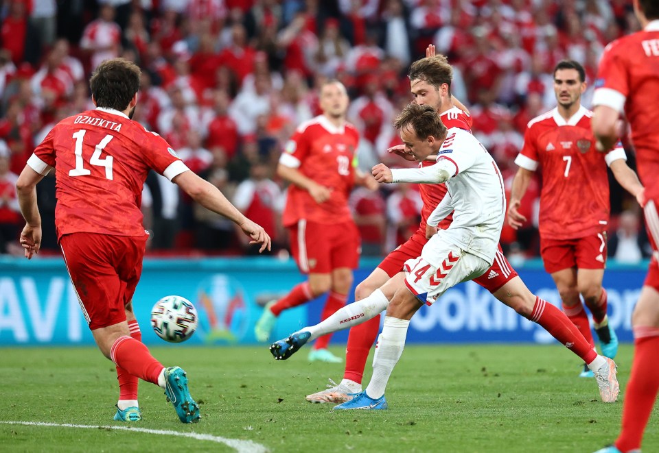 Mikkel Damsgaard hits the sweet opener for Denmark against Russia