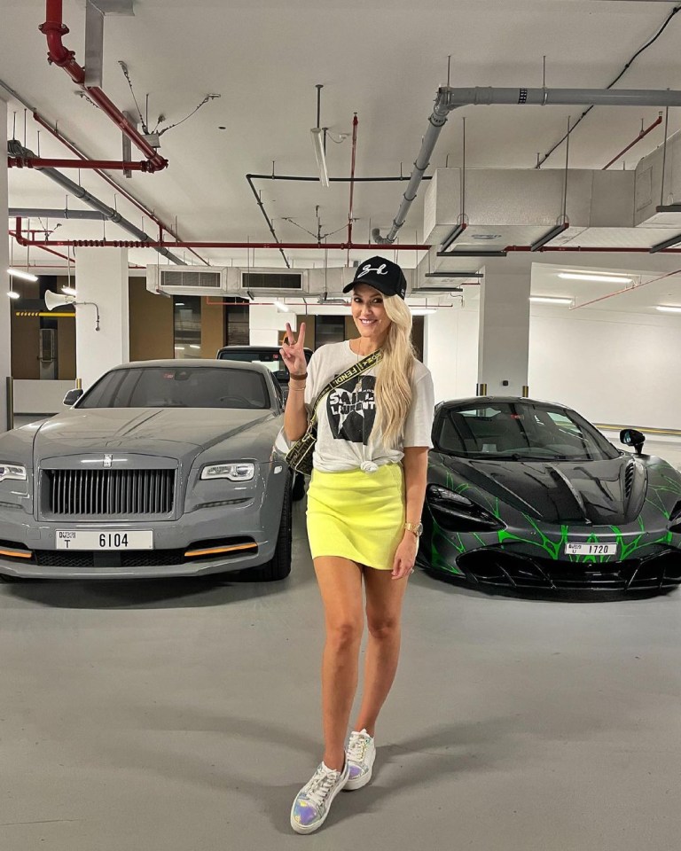 She can often be seen posing with Ferraris and Aston Martins