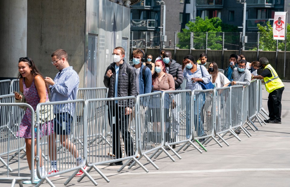 People queuing to get their Covid vaccination at the Emirates stadium, London