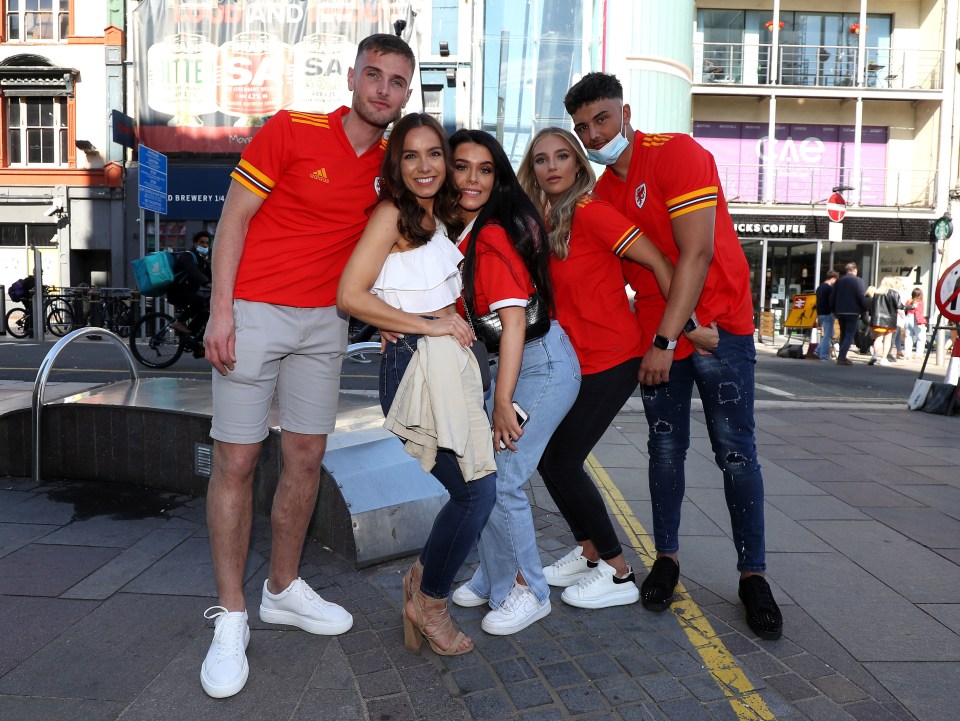 Fans pose as they head into Cardiff city centre