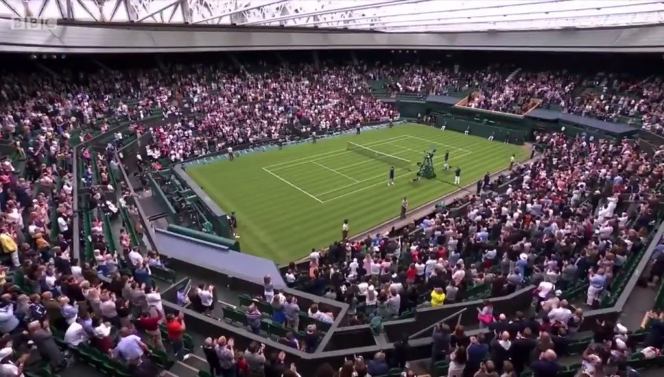 Centre Court rose to its feet for the vaccine creators on Monday