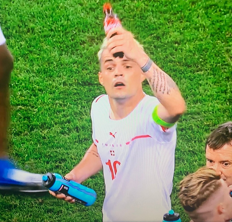 Granit Xhaka necked a bottle of Coca-Cola before the penalty shootout on Monday night