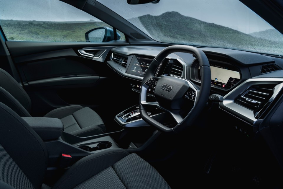 Most of all the Audi Q4 has those alluring four rings on the steering wheel