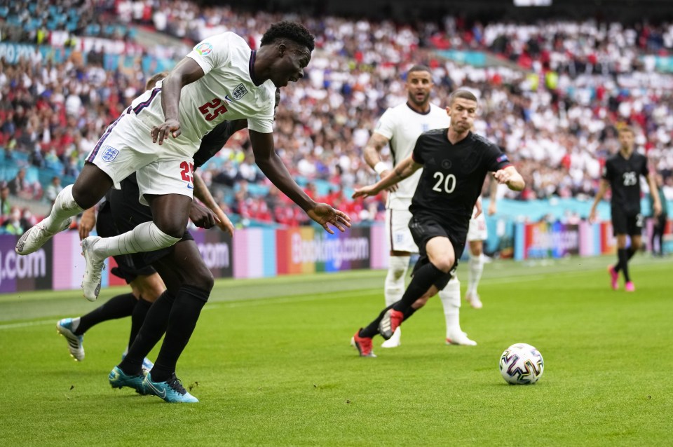 Bukayo Saka skips past Antonio Rudiger