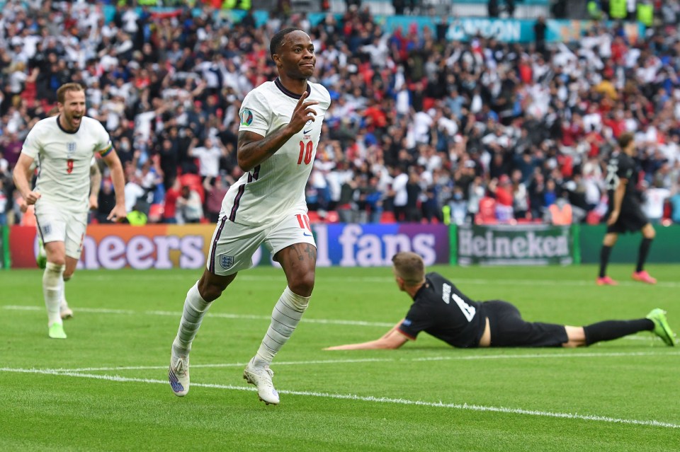 Raheem Sterling celebrates scoring England's opener