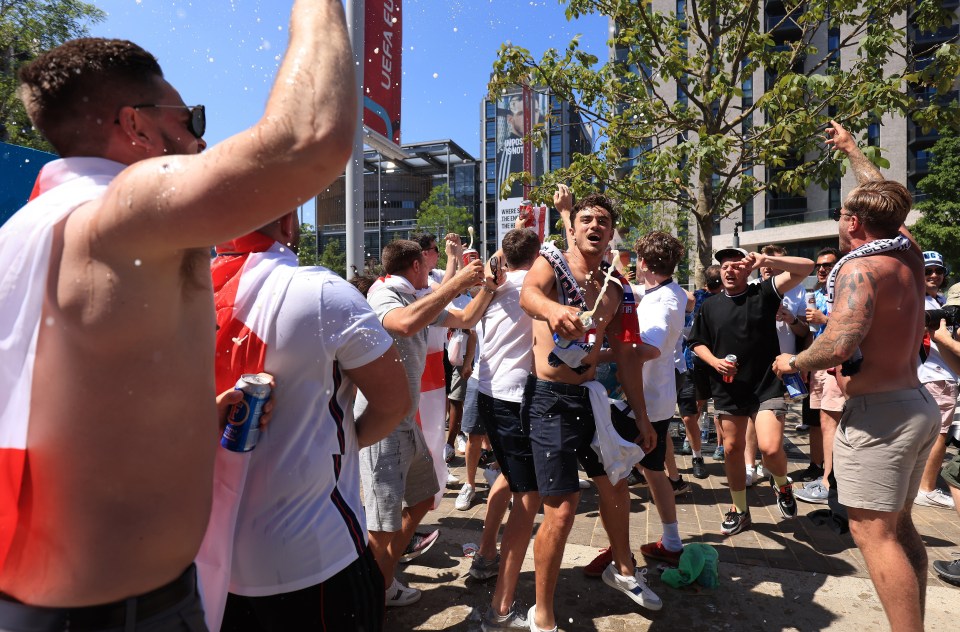 Beer falls from the sky as England fans spray booze over Wembley