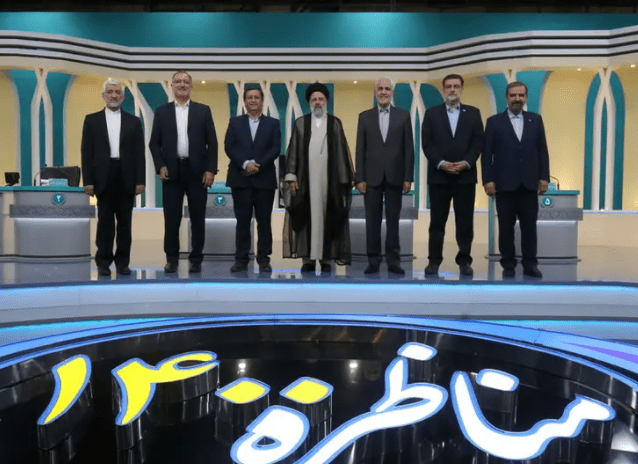 Iran's presidential candidates stand after the election debate at a television studio, in Tehran