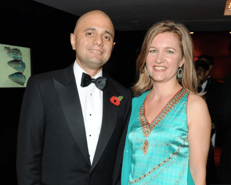 Mr Javid with wife Laura at a black-tie awards do in 2014