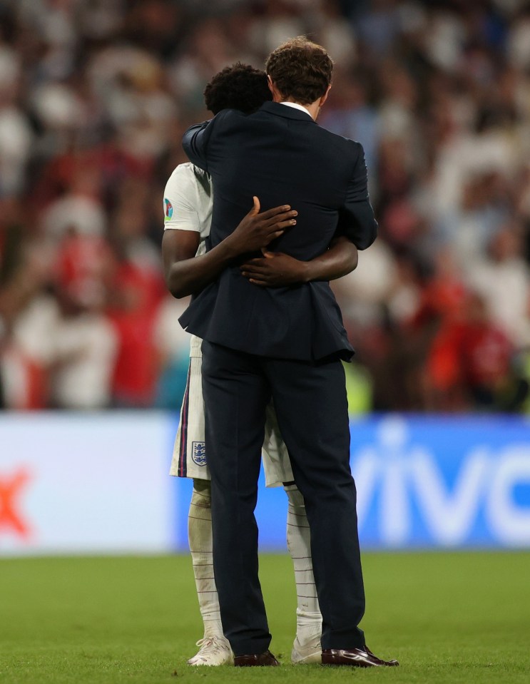 Southgate embraced Saka on the pitch after the devastating defeat