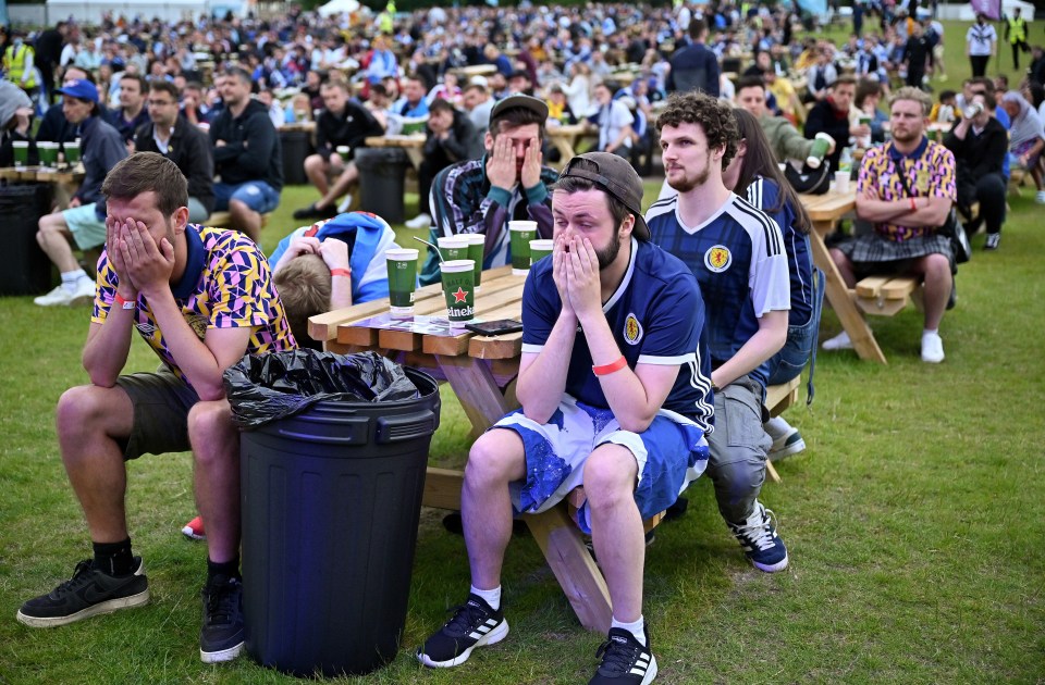 Supporters were pictured holding their heads in their hands after their team's defeat