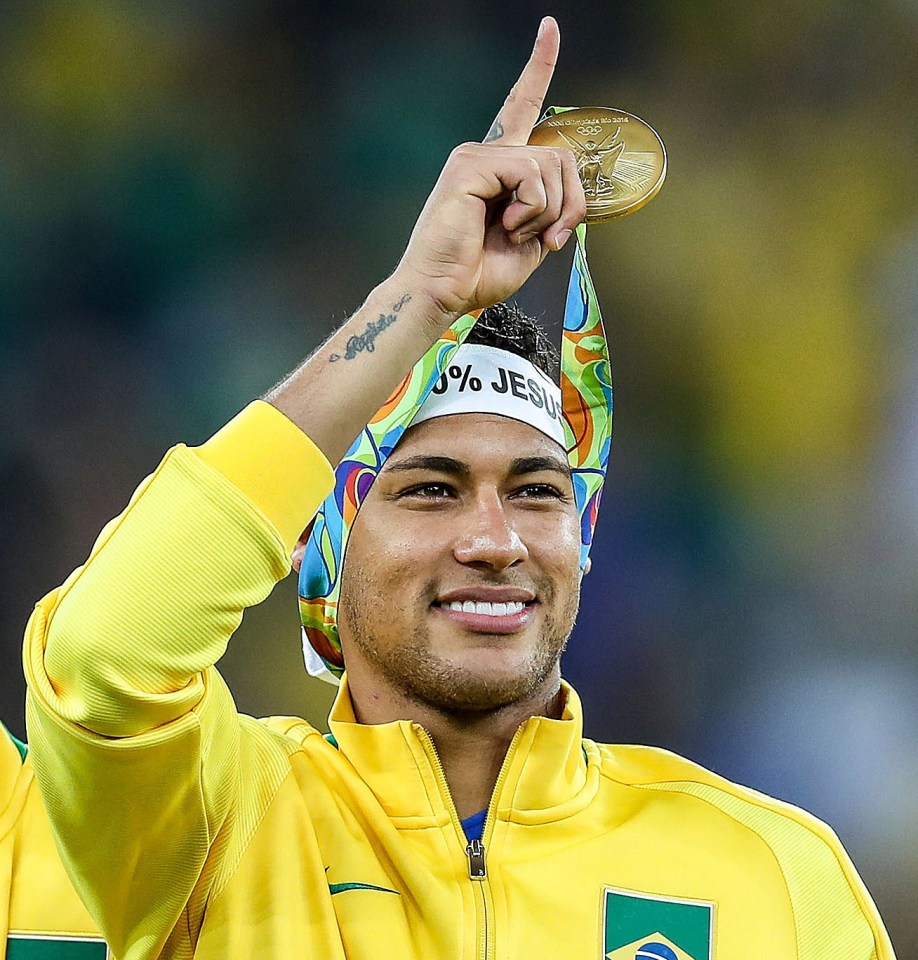 Neymar holds aloft a gold medal won at Rio 2016 for Brazil