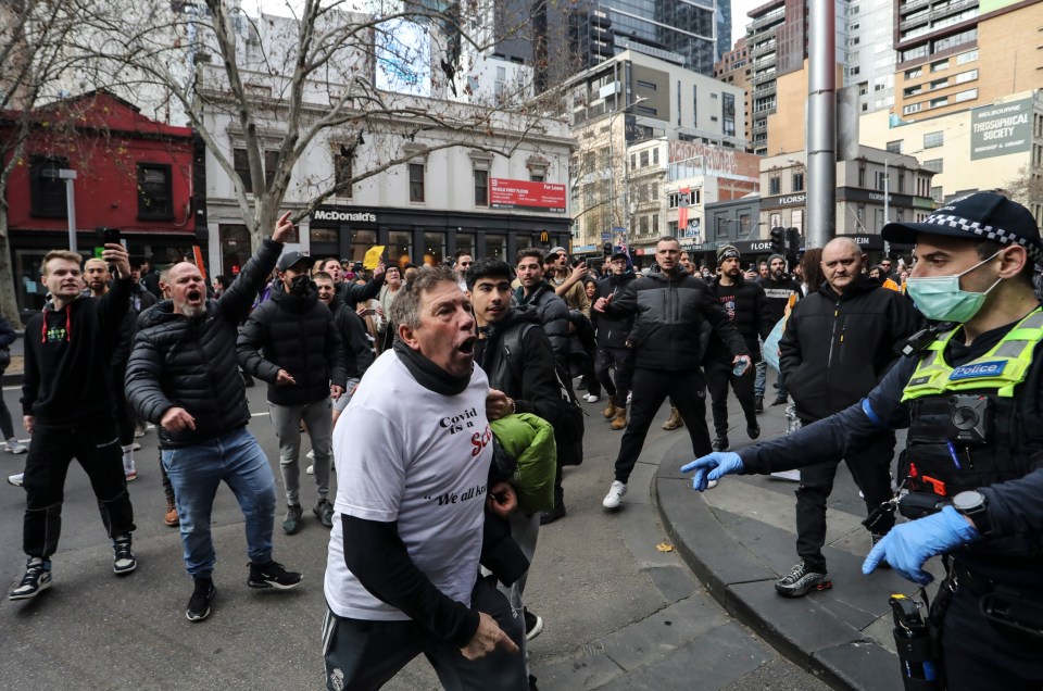 Protesters scream at police in Victoria Police at Russel Street, Melbourne