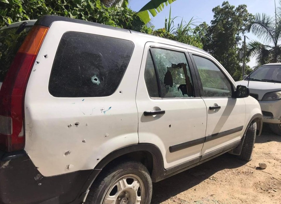 A damaged car from last night's attack