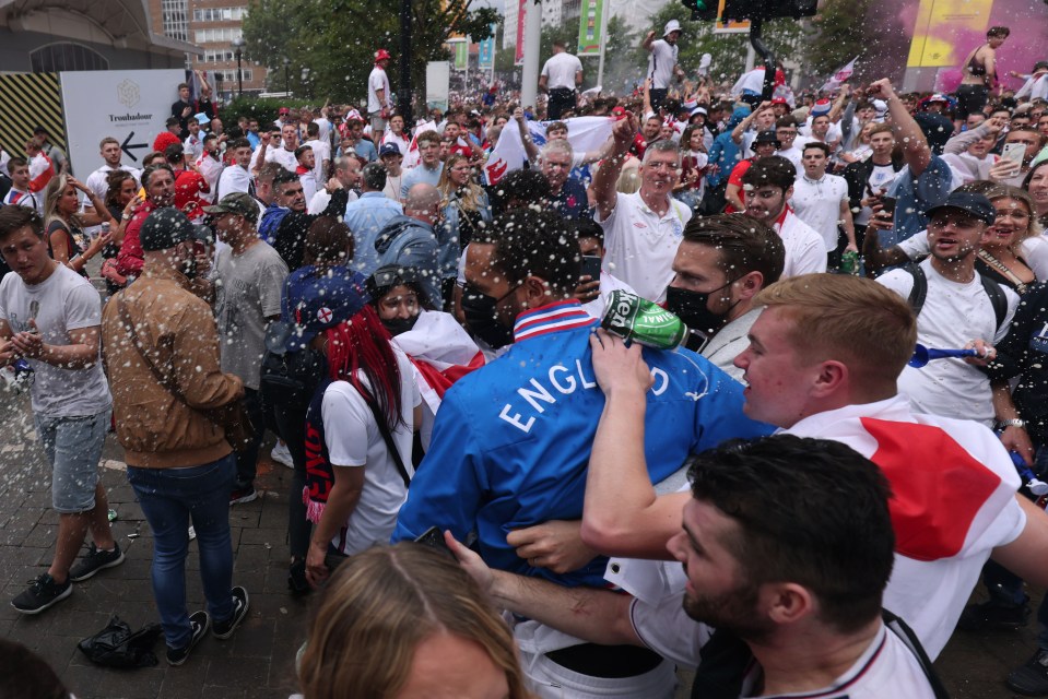 England and Man Utd legend Rio Ferdinand is hit with a Heineken can