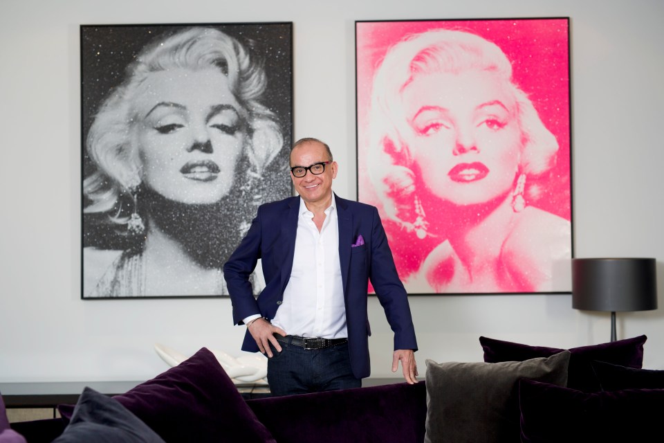 Touker Suleyman with Andy Warhol artworks - which have sold for tens of millions - at his home