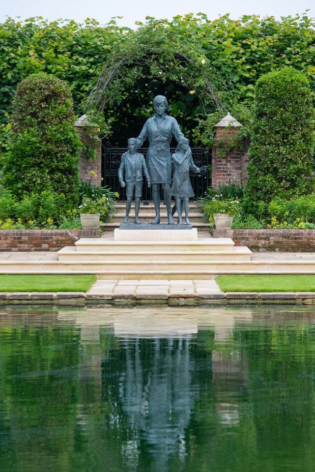 The statue shows Diana with three children