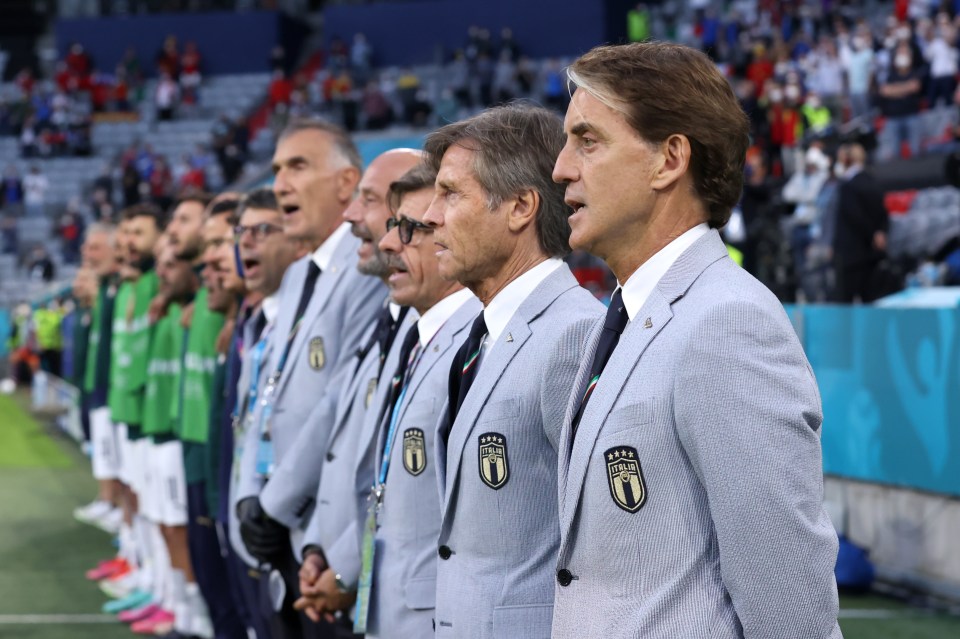 The Italian coaching staff have been kitted out in Giorgio Armani suits for the tournament