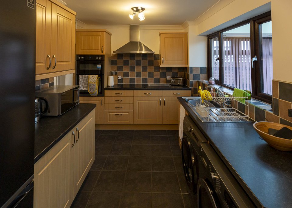 They have an open-plan kitchen and dining room, which backs out onto the conservatory