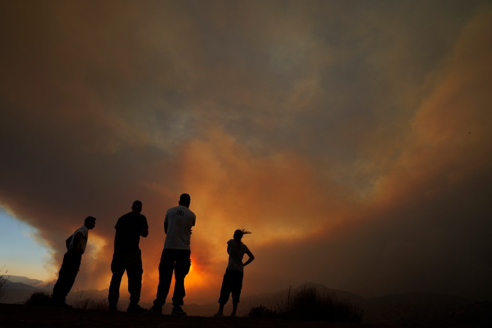 A group look at the orange skies as smoke rises over Cyprus