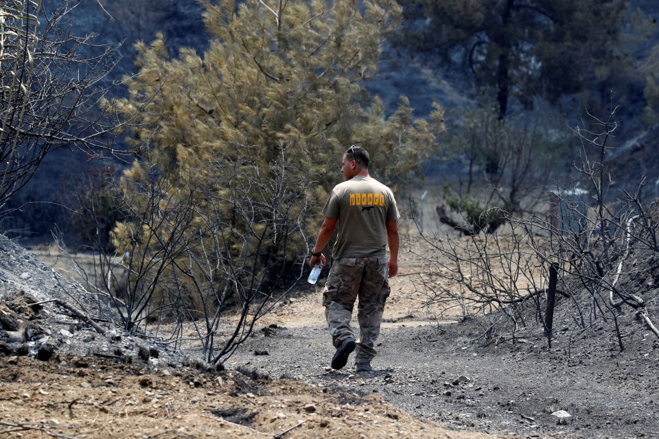 A man oversees the destruction as Cyprus comes to terms with the disaster