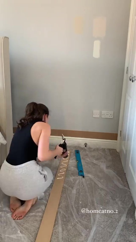 Glueing the panels to the wall